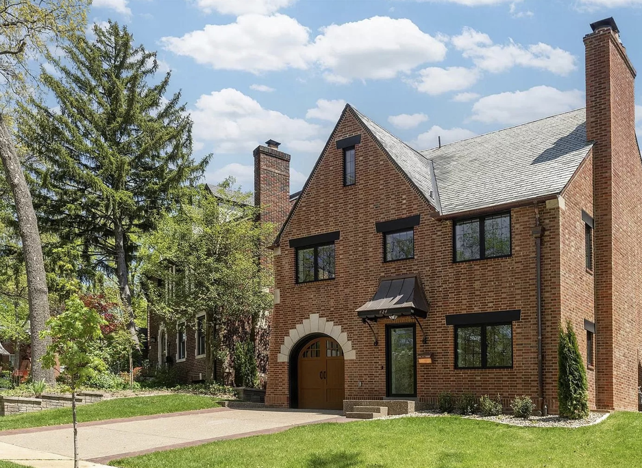 Front of two and a half story brick historic home.